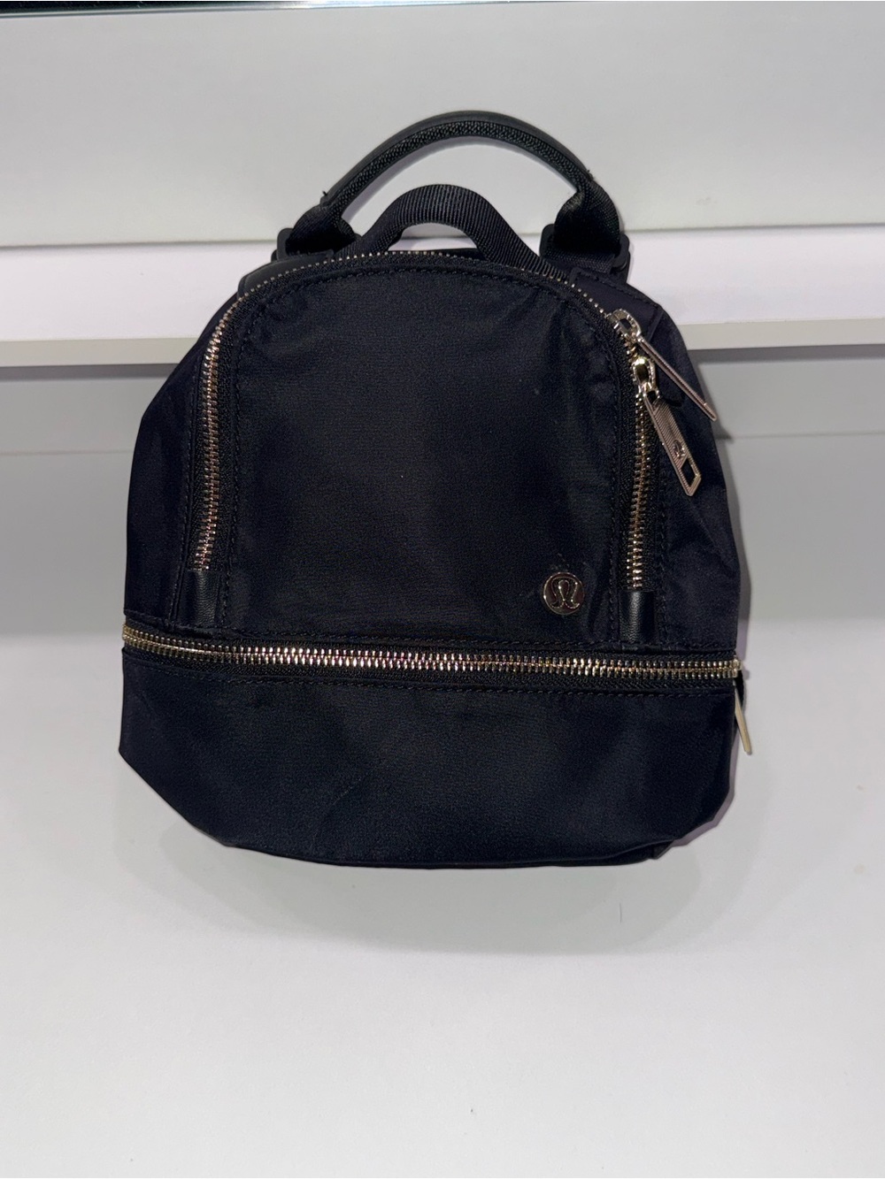 lululemon athletica Black Mini Backpack with Gold Zippers